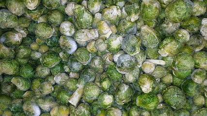 Close-Up Shot Of Frozen Brussels Sprouts. Texture Of Frozen Brussels Sprouts
