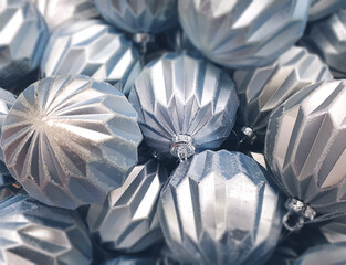 
Silver Christmas Baubles. Heap of Silver Christmas Balls, Close Up. Traditional Xmas and Happy New Year Symbol