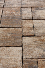 Paving the street with colored cement boulders. The color transition design simulates natural colors. Selective focus on the center of the composition.