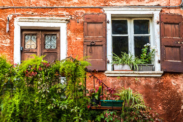 Fototapeta na wymiar old wooden window at a facade