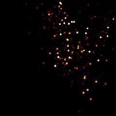 Golden abstract bokeh on black background.