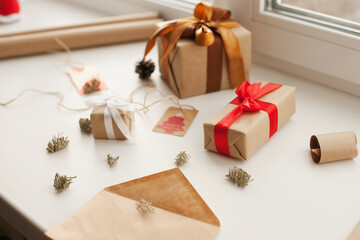 Wrapping christmas presents and gifts. Gift boxes for holiday season before gift giving.