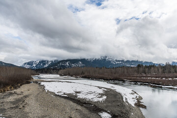Snow covered Columbia River Valley near Rivelstock Canada overcast day