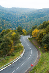 Asphalt road in the autumn mountain