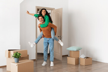 Happy man and woman having fun on moving day