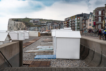 White beach huts at the seaside on the Albâtre coast in the town of Mer-les-Bains in France