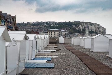 White beach huts at the seaside on the Albâtre coast in the town of Mer-les-Bains in France