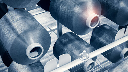 Reels of textile yarn blue thread at industrial weaving manufacturing machine