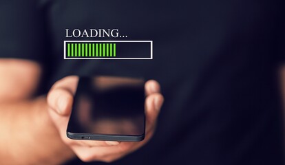 Hands of a man using mobile smartphone for download application and waiting to loading.