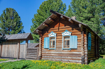 Facade of an old house made of Siberian larch on the shore of Lake Baikal.