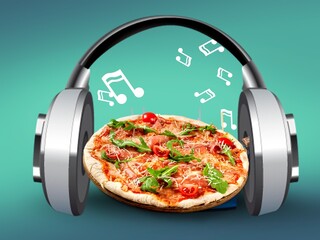 Composition with big pizza and headphones. Fastfood time, funny mood.