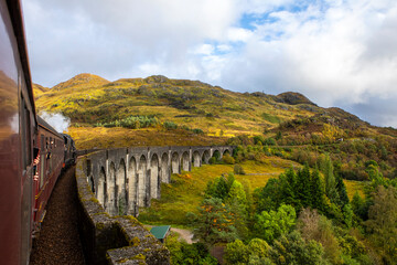 Jacobite Express Steam Train on the Glenfinnan Viaduct in the Scottish Highlands, UK