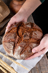 Traditional round rye bread оn a table. Healthy food.