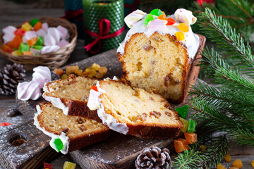 Christmas fruit cake with Christmas cake on wooden background