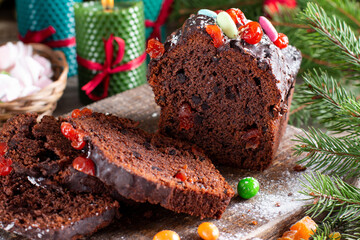 Christmas fruit cake with Christmas cake on wooden background