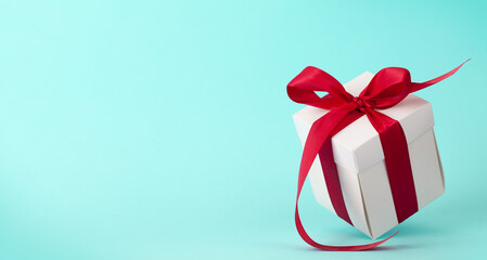 Gift box with red ribbon