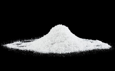 Heap of fluffy white snow isolated on a black background. Snow hills at night.