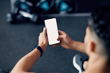 Mockup Image Of Young Athlete Man Using Blank Smartphone In Gym