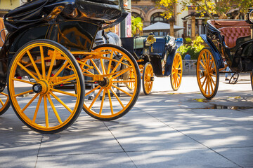 Horse carriage with wheels painted in medium yellow, buggy, typical Seville carriage