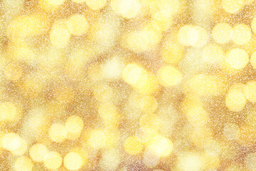 Luxury golden shine glitters background with blurred lights. Gold glitter texture surface.