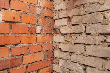 Fototapeta premium two walls of red and white brick solid background