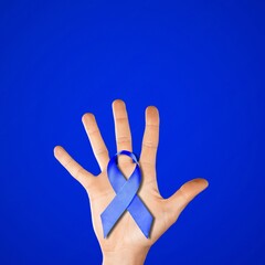 Blue ribbon cancer. Awareness prostate cancer of men health in November. Ribbon in hands