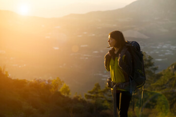 Fototapeta premium Happy girl is hiking in the mountains.