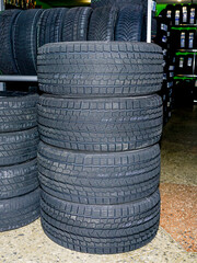 Obraz premium a set of new soft tread winter tires in a tire store