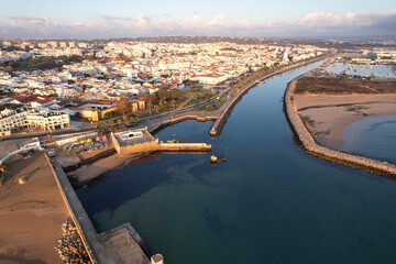 Fototapeta premium Aerial from the city Lagos in the Algarve Portugal at sunrise marina harbor