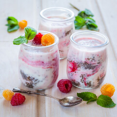 
Chia pudding in glass with raspberry . Breakfast yogurt