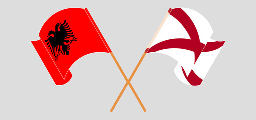 Crossed and waving flags of The State of Alabama and Albania