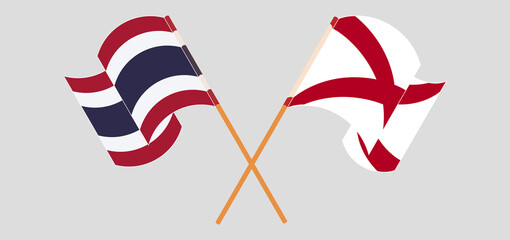 Crossed and waving flags of Thailand and The State of Alabama