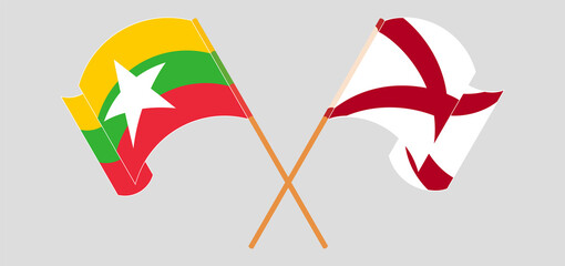 Crossed and waving flags of Myanmar and The State of Alabama
