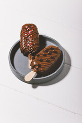 chocolate popsicle on a light background