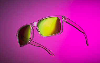 Sunglasses on a vibrant background.