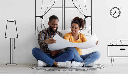 Cheerful black couple planning new house interior, holding blueprints