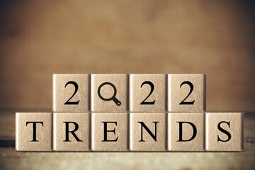 2022 trend concept. Hand flip wooden cube change on the desk