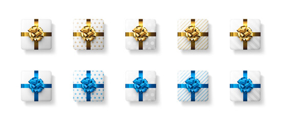 Naklejka premium Set of white gift boxes with beautiful foil bows.