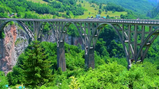Durdevica Tara Bridge, also known as the bridge of anti fascist, hero lieutenant Bozhidar Zugic, is a concrete arch bridge over the Tara Canyon River in northern Montenegro.