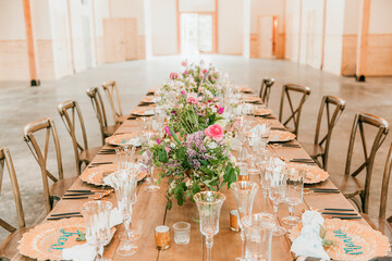 wedding couple hold hands at decoration wedding reception table 
