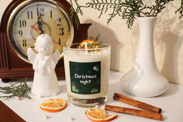 waiting for christmas. Christmas candle made from natural soy wax in the interior of the room....