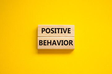 Positive behavior support symbol. Concept words Positive behavior on wooden blocks on a beautiful yellow background. Business, psychological and Positive behavior support concept. Copy space.
