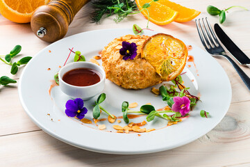 fried cutlet with almonds and orange