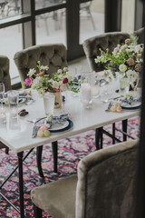 wedding reception table setting decorated with flowers and candles 