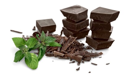 Milk chocolate and mint leaves on the desk