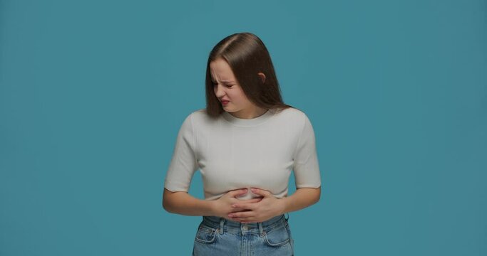 Intestinal disorder, indigestion. Ill young girl suffer stomachache, feel discomfort, bowel spasm from stress, hunger