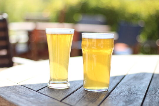 glass of beer on wooden table