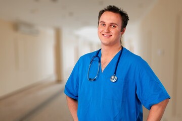 Smiling doctor wearing medical coat looking at camera.