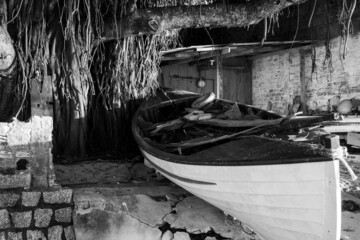 black and white image, boat kept at the fishermen's house
