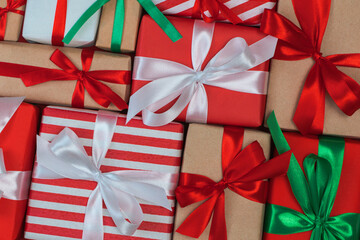 Above view of variuos gift boxes decorated with satin ribbon bows